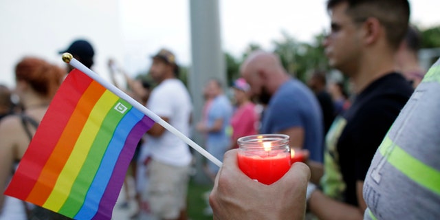 A vigil in memory of the victims of the Orlando mass shooting, Sunday, June 12, 2016, in Miami Beach, Fla.