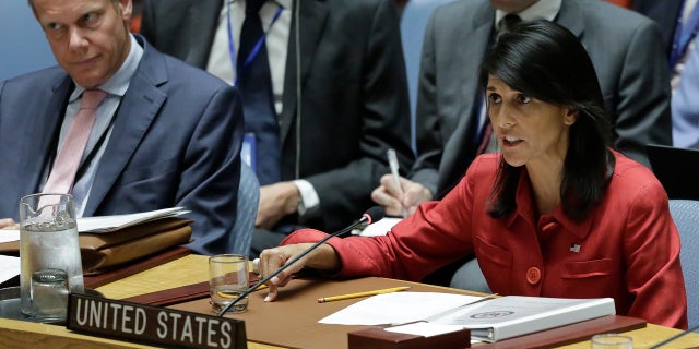 United Kingdom U.N. Ambassador Matthew Rycroft, left, listens as United States U.N. Ambassador Nikki Haley, right, respond to Russia's statements, during United Nations Security Council meeting on North Korea's latest launch of an intercontinental ballistic missile, Wednesday July 5, 2017 at U.N. headquarters. (AP Photo/Bebeto Matthews)