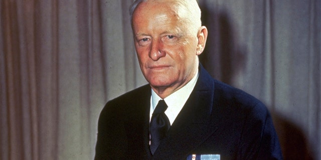 This undated file photo shows Adm. Chester W. Nimitz, commander of U.S. Naval forces in the Pacific during World War II, sitting on a desk in an unknown location.