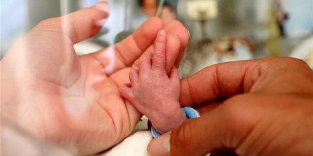 This July 25, 2006, handout photo provided by the March of Dimes Foundation shows a baby in the Neonatal Intensive Care Unit (NICU) at the Albany Medical Center in Albany, NY.