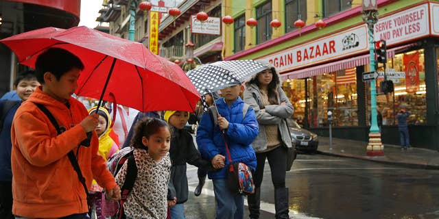 Feb. 6, 2015: Children from San Francisco Community School walk through Chinatown while on a field trip.