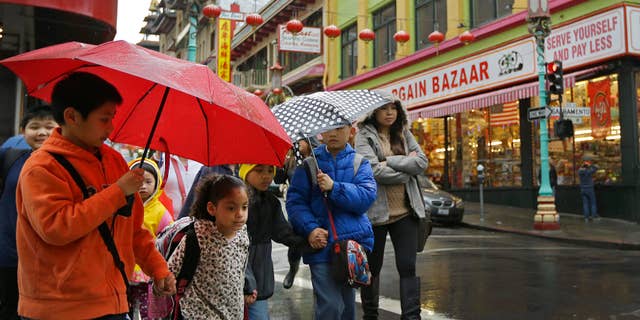 Feb. 6, 2015: Children from San Francisco Community School walk through Chinatown while on a field trip.