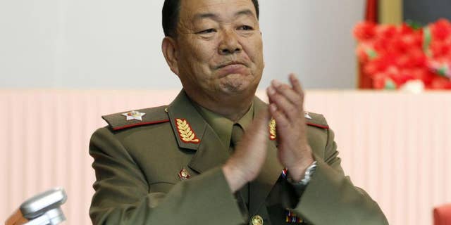 FILE - In this July 18, 2012, file photo, then Vice Marshal Hyon Yong Chol applauds during a meeting in Pyongyang, North Korea. North Korean leader Kim Jong Un ordered his defense chief Hyon Yong Chol executed with an anti-aircraft gun for complaining about the young ruler, talking back to him and sleeping during a meeting presided over by Kim, South Korea's spy agency told lawmakers Wednesday, May 13, 2015, citing what it called credible information. (AP Photo/Jon Chol Jin, File)