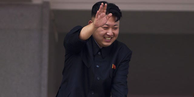 FILE - In this July 27, 2013 file photo, North Korean leader Kim Jong Un leans over a balcony and waves to Korean War veterans cheering below at the end of a mass military parade on Kim Il Sung Square in Pyongyang to mark the 60th anniversary of the Korean War armistice. (AP Photo)