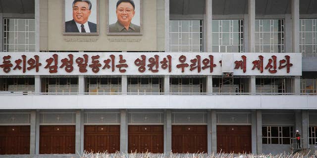 In this Tuesday, Sept. 15, 2015, photo, North Koreans gather in to prepare for events to be held during the 70th anniversary of the founding of their country's ruling party in October, in Pyongyang, North Korea. North Korea is already in high gear as it prepares to mark the 70th anniversary of the founding of its ruling party. Students and workers are being mobilized by the thousands to practice their parts in the grand show - some carrying wooden torches, others bouquets of red plastic flowers. (AP Photo/Wong Maye-E)