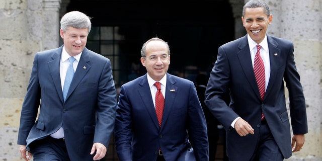In this Aug. 10, 2009, photo, President Barack Obama, right, Mexico's President Felipe Calderon, center, and Canada's Prime Minister Stephen Harper walk towards a stand for an official photo in Guadalajara, Mexico, for a North American summit. (AP Photo/Alex Brandon, File)