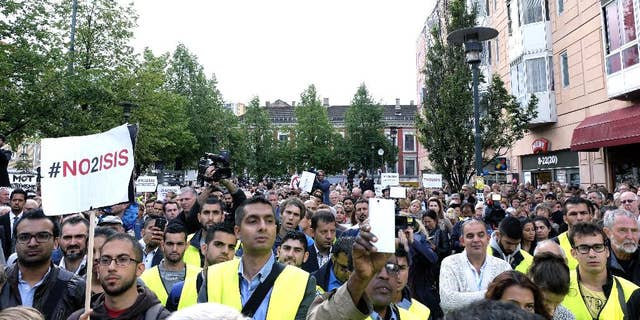 Some of the almost 5,000 protestors attending a demonstration against ISIS, in Oslo, Monday, Aug. 25, 2014. Different Muslim groups were behind the initiative which was attended by political and Muslim leaders. ISIS is an acronym for the Islamic State group. (AP Photo/NTB Scanpix, Torstein Boe) NORWAY OUT
