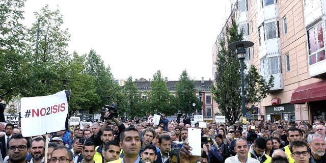 Some of the almost 5,000 protestors attending a demonstration against ISIS, in Oslo, Monday, Aug. 25, 2014. Different Muslim groups were behind the initiative which was attended by political and Muslim leaders. ISIS is an acronym for the Islamic State group. (AP Photo/NTB Scanpix, Torstein Boe) NORWAY OUT
