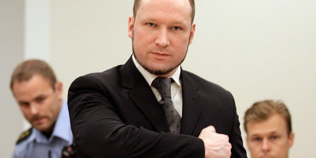 Aug. 24, 2012: Norwegian Anders Behring Breivik gestures as he arrives at the courtroom in Oslo, Norway. Anders Behring Breivik has been declared sane and sentenced to prison for bomb and gun attacks that killed 77 people last year.