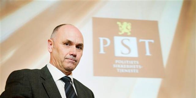 March 16, 2012: A projection causing striation on the face of acting head of Norway's domestic intelligence service PST, Roger Berg, as he faces the media.