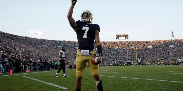 Nov. 17, 2012: Notre Dame Fighting Irish wide receiver TJ Jones (7) celebrates after making a touchdown catch against Wake Forest Demon Deacons during the first half of their NCAA college football game at Notre Dame Stadium in South Bend, Indiana. (Reuters)