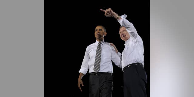 President Obama campaigning with Harry Reid. (AP Photo)