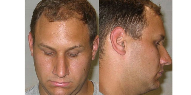 This undated photo released by the Shaker Heights police department shows the booking photo of Andrew Martin. Martin, 23, of Bristolville, near Warren, Ohio, allegedly tried to resolve a house ownership fight by offering $10,000 to kill the dead owner's sister.