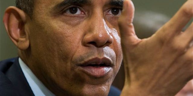 President Barack Obama delivers remarks during a meeting with people that wrote him letters explaining how they benefited from the Affordable Care Act in the Roosevelt Room of the White House, on Tuesday, Feb. 3, 2015, in Washington. Obama also condemned the execution of Jordanian Air Force pilot First Lt. Moaz al-Kasasbeh by the Islamic State group. (AP Photo/Evan Vucci)