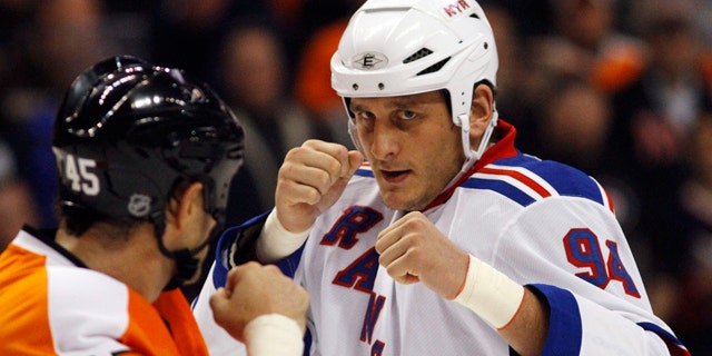 In this Nov. 4, 2010 file photo, Philadelphia Flyers' Jody Shelley, left, and New York Rangers' Derek Boogaard fight during an NHL hockey game in Philadelphia. Boogaard, at age 28, died on Friday. Boogaard signed with the Rangers as a free agent in July 2010 and appeared in 22 games last season, registering one goal and one assist. (AP)
