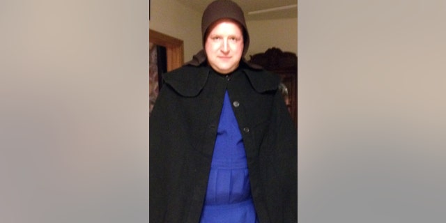 In this undated photo provided by Sgt. Chad Adams of the Pulaski Township Police, Adams is seen dressed as an Amish woman. Adams, a male police officer, spent time on duty in December and January dressed as an Amish woman in hopes of scaring off a man suspected of exposing himself to Amish children in a western Pennsylvania township. The Amish did not want their children to testify in court and agreed to lend police the women's bonnets, aprons and dresses to catch or scare away the suspect. (AP Photo/Courtesy of Chad Adams)