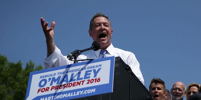 BALTIMORE, MD - MAY 30: Former Maryland Gov. Martin O'Malley speaks as his wife Katie listens during an event to announce his candidacy for a presidential campaign May 30, 2015 at Federal Hill Park in Baltimore, Maryland. O'Malley was the third Democrat, after former U.S. Secretary of State Hillary Clinton and Sen. Bernie Sanders (I-VT), to throw his hat in the ring for the Democratic nomination. (Photo by Alex Wong/Getty Images)