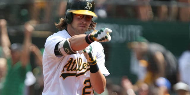 Jul 19, 2015; Oakland, CA, USA; Oakland Athletics right fielder Josh Reddick (22) reacts after hitting a grand slam home run against the Minnesota Twins during the fifth inning at O.co Coliseum. Mandatory Credit: Kelley L Cox-USA TODAY Sports