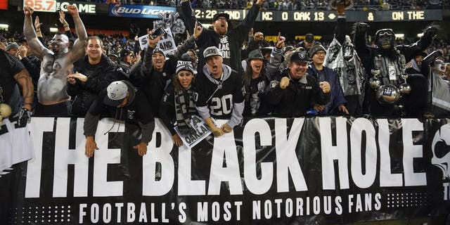 November 20, 2014; Oakland, CA, USA; Oakland Raiders fans celebrate during the second quarter against the Kansas City Chiefs at O.co Coliseum. Mandatory Credit: Kyle Terada-USA TODAY Sports