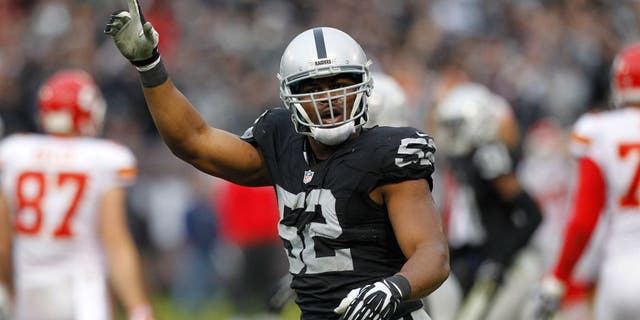 Dec 6, 2015; Oakland, CA, USA; Oakland Raiders outside linebacker Khalil Mack (52) reacts after the Kansas City Chiefs missed an extra point attempt in the fourth quarter at O.co Coliseum. The Chiefs defeated the Raiders 34-20. Mandatory Credit: Cary Edmondson-USA TODAY Sports