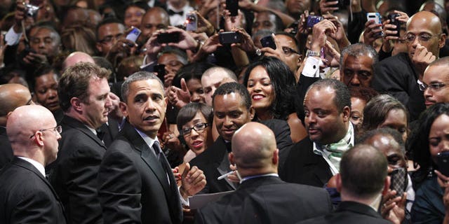 September 24: President Barack Obama turns around looking for first lady Michelle Obama as he greets the crowd at the Congressional Black Caucus Foundation Annual Phoenix Awards in Washington.