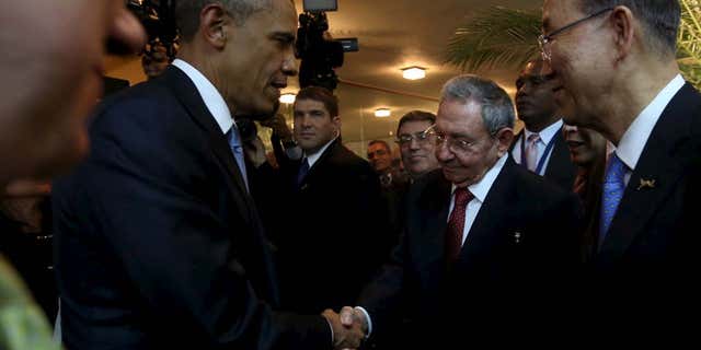 April 10, 2015: U.S. President Barack Obama (L) and his Cuban counterpart Raul Castro shake hands as U.N. Secretary General Ban Ki-moon (R) looks on, before the inauguration of the VII Summit of the Americas in Panama