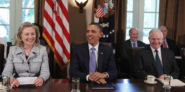 May 3: President Barack Obama, seated between Secretary of State Hillary Rodham Clinton and Defense Secretary Robert Gates at the start of a Cabinet meeting at the White House in Washington.