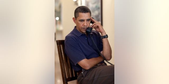 President Barack Obama participates in conference call with NSC chief of staff Denis McDonough and homeland security advisor John Brennan about preliminary assessments from the ongoing consultations the President has ordered in human and systematic failures that occurred leading up to attempted terrorist Christmas Day attack. The phone call took place in Kailua, Hawaii Dec. 31, 2009. (Official White House photo by Pete Souza)