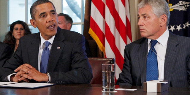 President Obama meets with Chuck Hagel, then co-chairman of the president's Intelligence Advisory Board, in this 2009 file photo.