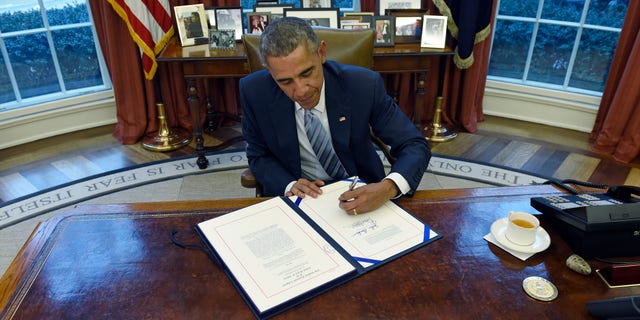 President Obama signs the Department of Homeland Security Appropriations Act on March 4, 2015.