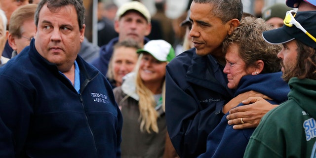Oct. 31, 2012: President Obama hugs North Point Marina owner Donna Vanzant as he tours damage done by Hurricane Sandy in Brigantine, N.J.