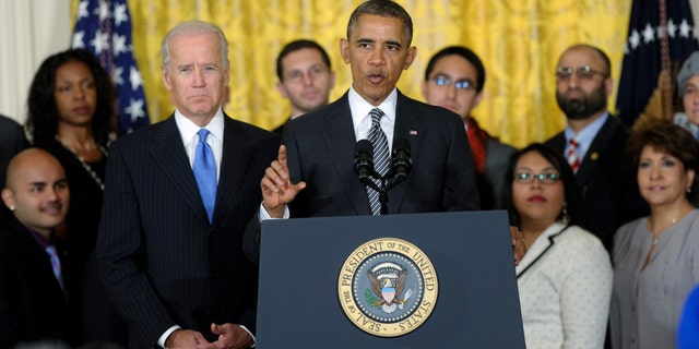 President Barack Obama, standing next to Vice President Joe Biden, urges Congress to take back up comprehensive immigration reform while speaking in the East Room of the White House in Washington, Thursday, Oct. 24, 2013. Obama said now that the partial government shutdown is over, Republicans and Democrats should be able to work together to fix what he called "a broken immigration system." (AP Photo/Susan Walsh)