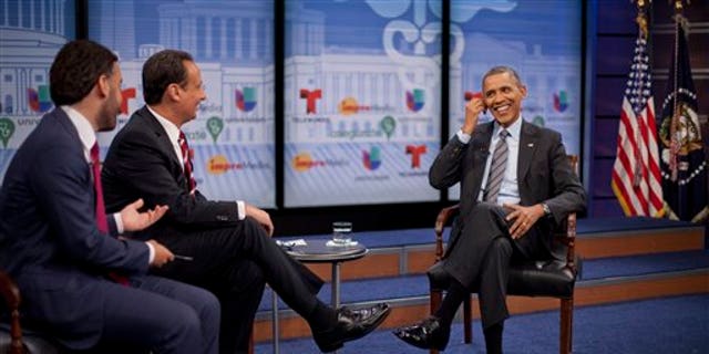President Obama with television hosts Jose Diaz Balart and Enrique Acevedo, in Washington, Thursday, March 6, 2014.