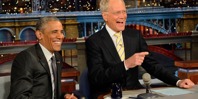 In this image released by CBS, President Barack Obama, left, appears with host David Letterman during a taping of "Late Show with David Letterman," on Monday, May 4, 2015, in New York. (John Filo/CBS via AP)