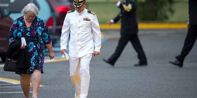 Mourners leave a funeral service for Navy Yard shooting victim Martin Bodrog, of Annandale, Va., at the Immanuel Bible Church in Springfield, Va., Saturday, Sept. 21, 2013. (AP Photo/Cliff Owen)