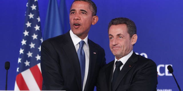 November 3, 2011: U.S. President Barack Obama, left, and French President Nicolas Sarkozy shake hands after they made statements to reporters after their meeting at the G20 Summit in Cannes.