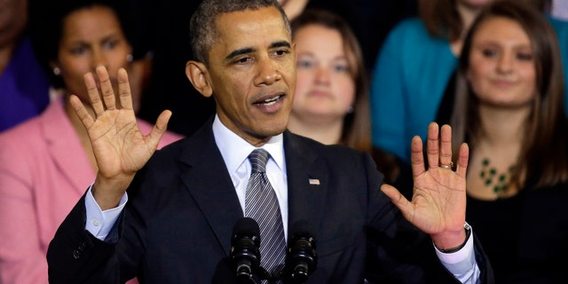 FILE - In this Oct. 30, 2013, file photo, President Barack Obama speaks at Boston's historic Faneuil Hall about the federal health care law. Obama says he's sorry Americans are losing health insurance plans he repeatedly said they could keep under his signature health care law. But the president stopped short of apologizing for making those promises in the first place. "I am sorry that they are finding themselves in this situation based on assurances they got from me," he said in an interview Thursday, Nov. 7 with NBC News. (AP Photo/Stephan Savoia, File)