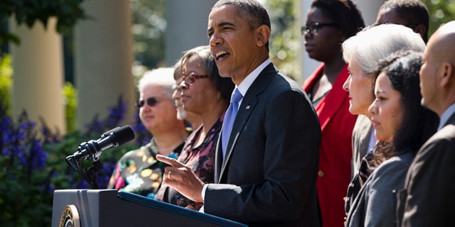 President Barack Obama gestures while speaking in the Rose Garden of the White House in Washington, Tuesday, Oct. 1, 2013, to talk about the government shutdown. Congress plunged the nation into a partial government shutdown Tuesday as a protracted dispute over Obama's signature health care law reached a boiling point, forcing some 800,000 federal workers off the job. (AP Photo/ Evan Vucci)