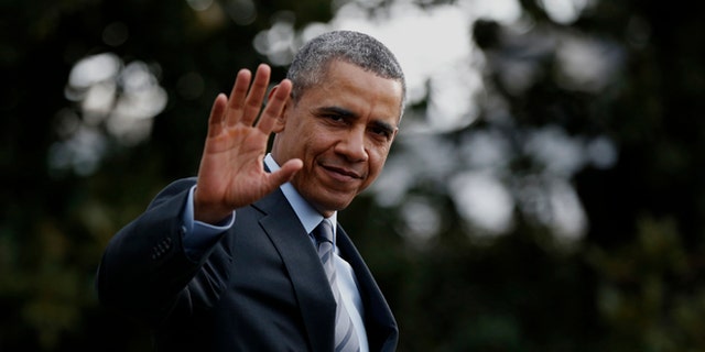 President Barack Obama waves to reporters as he walks on the South Lawn of the White House in Washington, Wednesday, Feb. 19, 2014, before boarding the Marine One helicopter to Andrews Air Force Base, Md., for his trip to Mexico. (AP Photo/Charles Dharapak)