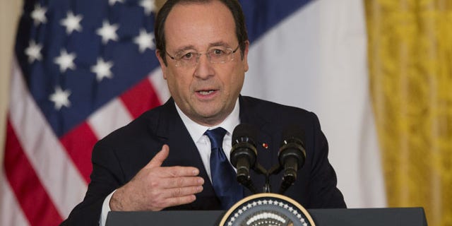 February 11, 2014: French President François Hollande speaks during a joint news conference with President Barack Obama, as part of an official state visit in the East Room of the White House in Washington. (AP Photo/ J. Scott Applewhite)