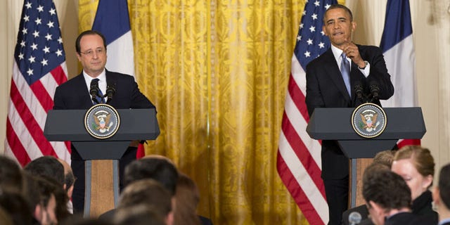 February 11, 2014: President Barack Obama calls on a reporter during a joint news conference with French President François Hollande, as part of an official state visit in the East Room of the White House in Washington. (AP)