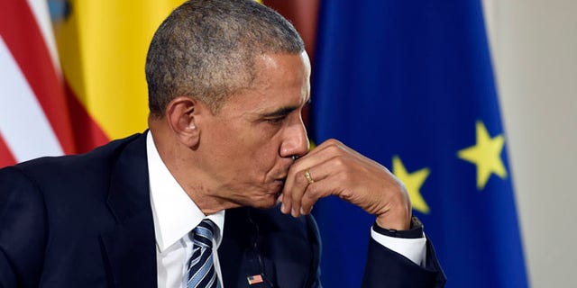 U.S President Barack Obama listens as Spain's acting Prime Minister Mariano Rajoy speaks during a media availability in Madrid, Spain, at the Palacio de la Moncloa, Sunday, July 10, 2016. (AP Photo/Susan Walsh)