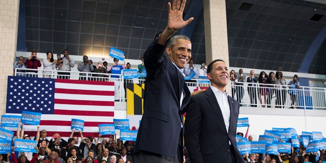 In this Sunday, Oct. 19, 2014 photo, President Barack Obama, left, stands with Maryland gubernatorial candidate Anthony Brown during a campaign rally at Wise High School in Upper Marlboro, Md.