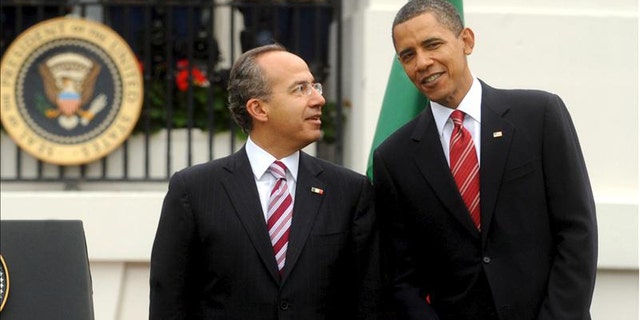 Thursday: President Obama poses for photos with Mexican President Felipe Calderon.