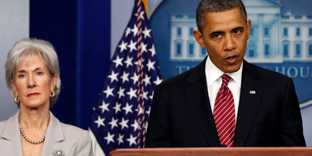 U.S. President Barack Obama makes a statement next to Secretary of HHS Kathleen Sebelius about contraceptive care funding in the press room of the White House in Washington.