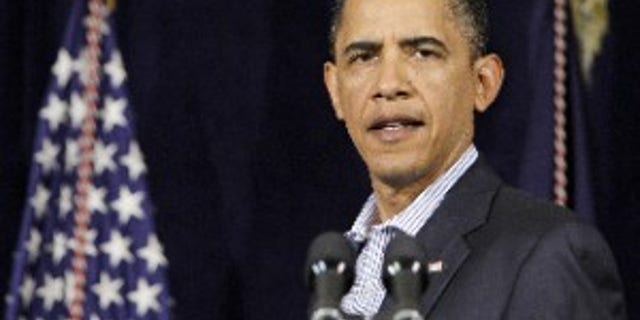 President Barack Obama speaks at the Marine Corps Base Hawaii in Kaneohe Bay, Hawaii Tuesday, Dec. 29, 2009. (AP Photo/Alex Brandon)