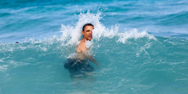 President Barack Obama, daughters Sasha and Malia, and and friends swim at Pyramid Rock Beach at Marine Corps Base Hawaii, Kaneohe Bay, Hawaii, Jan. 1, 2012. (Official White House Photo by Pete Souza)