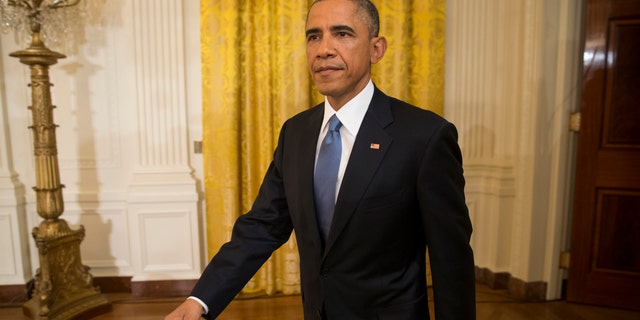 President Barack Obama arrives to a news conference in the East Room of the White House, on Wednesday, Nov. 5, 2014, in Washington.One day after sweeping Republican election gains, President Obama and incoming Senate Majority Leader Mitch McConnell pledged to try and turn divided government into a force for good rather than gridlock on Wednesday, yet warned of veto showdowns as well. Trade legislation loomed as one possibility for quick compromise, and immigration as an early irritant. (AP Photo/Evan Vucci)