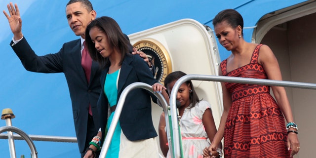March 19: President Obama and the First Family emerge from Air Force One after arriving in Brasilia, Brazil.