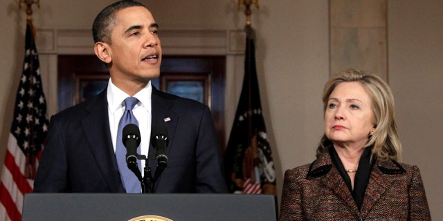 Feb. 23: Obama, with Secretary of State Hillary Rodham Clinton at right, speaks about the situation in Libya in Washington. The Obama administration could impose travel bans, freeze assets and take other steps against Qaddafi loyalists as early as Feb. 25, officials said.